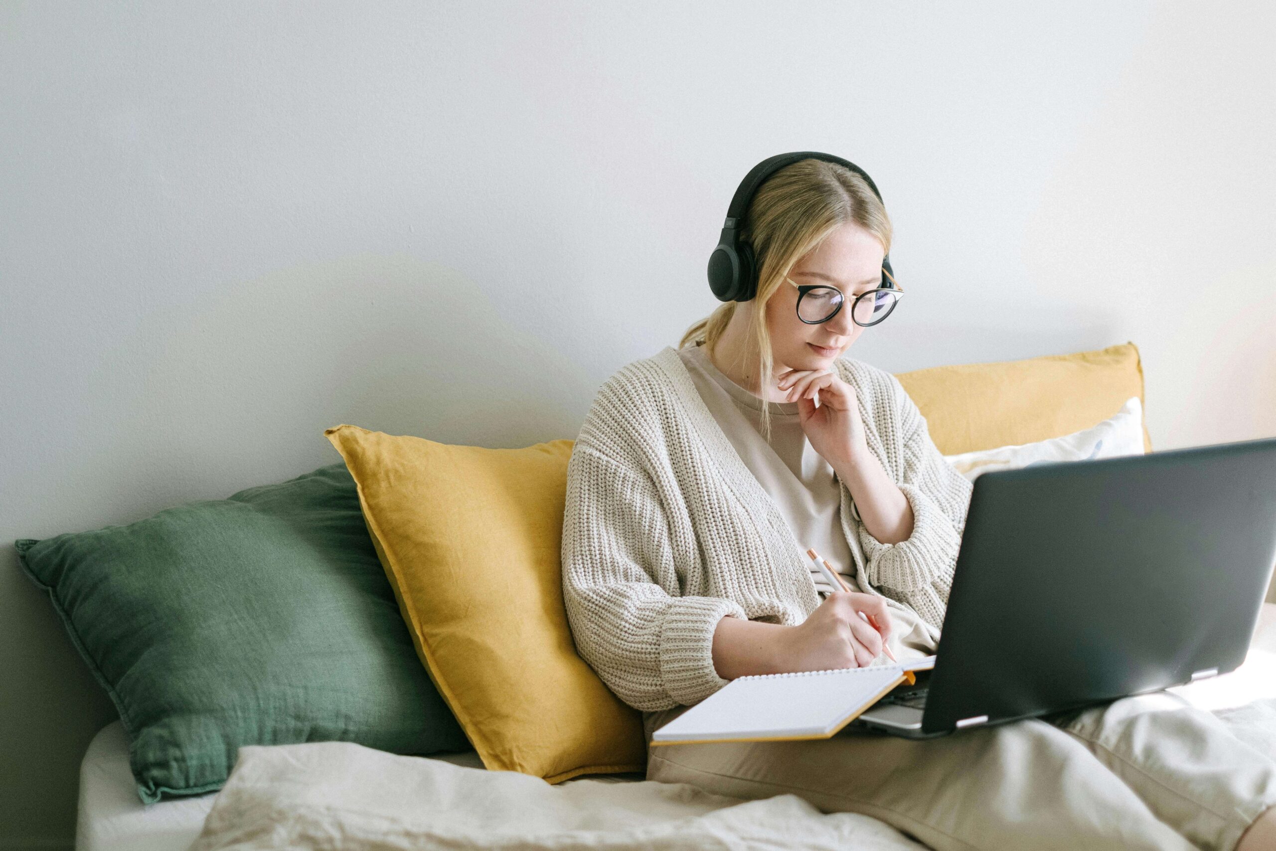 Woman on her laptop checks her website.